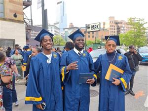 3 students smiling